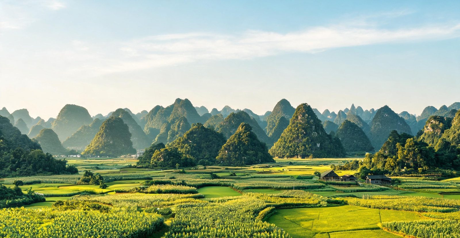 Karst peaks rising above fields at Wanfenglin, Guizhou